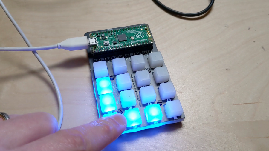The Pico RGB keypad base from pimoroni is a DIY kit that takes the Raspberry Pi Pico and gives you an a 16 button matrix of rgb LEDs, ready to program however you like using MicroPython or CircuitPython.